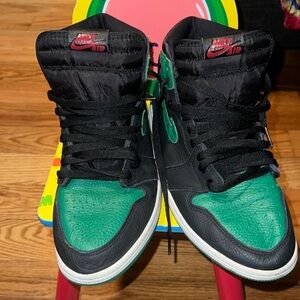 Green and black Jordan 1s